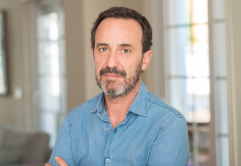 Fototapeta premium Handsome middle age man with a confident expression on smart face thinking serious