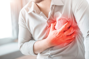 Obraz premium Man having severe chest pain, suffering from heart attack.