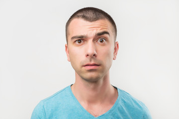 Fototapeta premium Doubt, mistrust, distrust concept. Doubtful italian man looking with disbelief expression. Hedoes not trust anybody