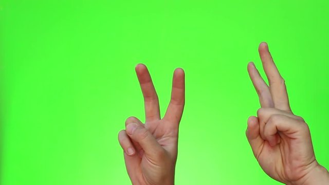 Air quotes. Finger quotes. Virtual quotation. Formed in the air with one's fingers when speaking. Chromakey. Green Screen. Isolated
