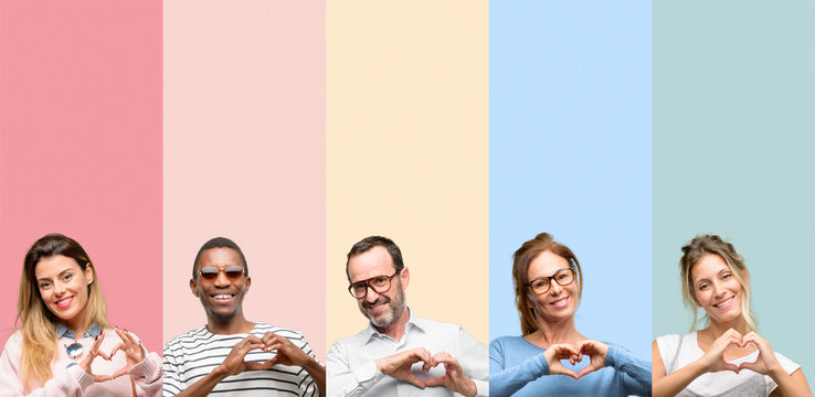 Mixed group of people, women and men happy showing love with hands in heart shape expressing healthy and marriage symbol