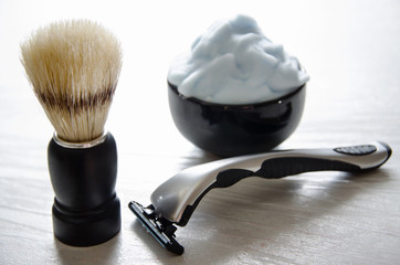 Shaving accessories. Glass table with reflections.