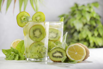cocktail with kiwi, lemon and mint