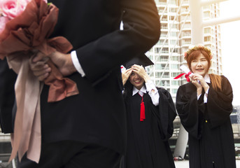 Beautiful Graduate graduates woman smile and are happy after graduation.