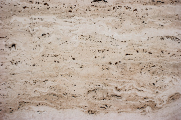 Stone surface of a dark yellow sandstone - background, texture