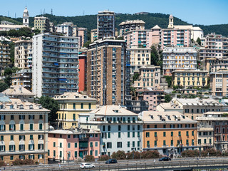 Fototapeta na wymiar Panoramic view of the magnificent Italian city of Genoa on a sunny summer day against the blue sky. Concept of travel and recreation