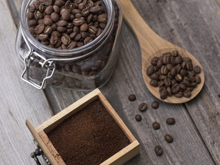 roasted coffee beans on a wooden table. 