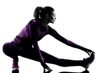 one young caucasian woman runner running jogger jogging isolated silhouette shadow on white background