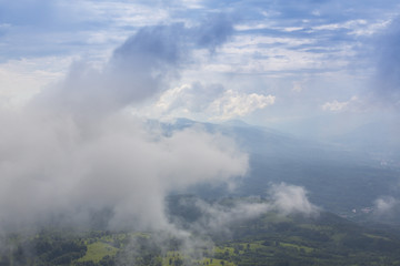 Fototapeta premium Summer scenery in the mountains, with rain and mist clouds