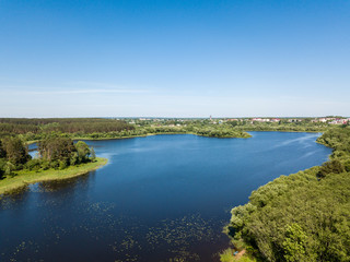 Fototapeta na wymiar Beautiful aerial view of lake and forest district. Belarus is th