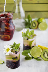 cocktail with blueberries and lime