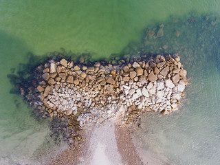 Aerial View of a Whale Shaped Rocky Breakwater Barrier