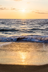 Fototapeta na wymiar Orange beach sunset or sunrise