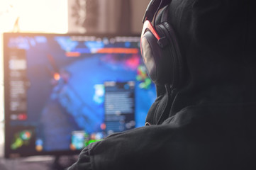 Back view of man playing PC game