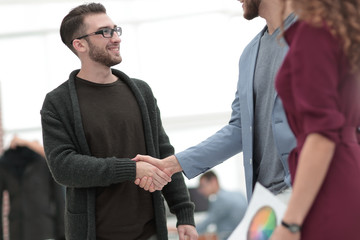 closeup.the handshake between the designer and the client