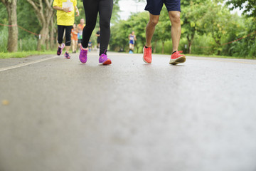 Group of people running race marathon