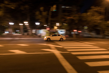 Fototapeta na wymiar SANTA CRUZ, TENERIFE / SPAIN - FEBRUARY 27 2018: Cars moving at night street.