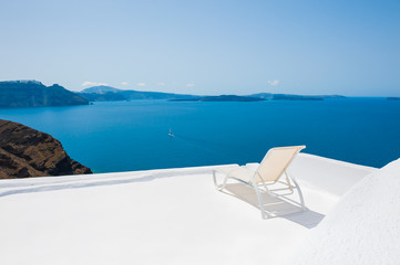 Chaise lounge on the terrace, Santorini island, Greece