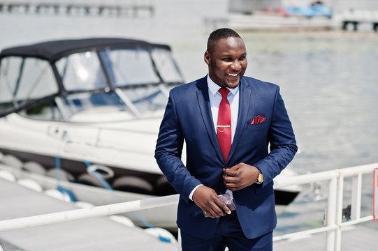 African American Happy Successful Man At Suit Against Yacht. Rich Black Business Man.