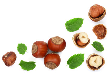 Hazelnuts with leaves with copy space for your text isolated on white background. Top view. Flat lay