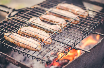 barbecue sausages on naked flame/barbecue sausages on naked flame, selective focus