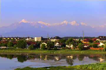 mountain landscape, with a village by the river