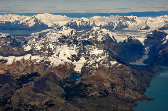 aerial view of Cerro Moyano and Cerro Norte with the southern patagonian ice field and Cerro Agassiz, or Cerro Roma or Cerro Bertrand in the back. Patagonia, Argentina - Powered by Adobe