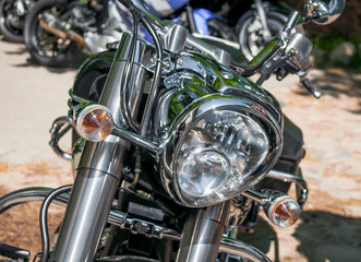 Fototapeta na wymiar Motorcycle headlights. Photo of motorcycle headlights close-up