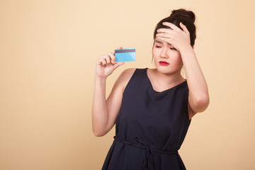 Young Asian woman headache with a blank card.