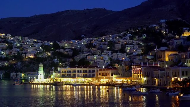 Footage of the harbour on island Symi in Greece at night.