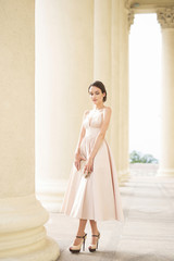 Fototapeta premium Elegant fashion girl in the city