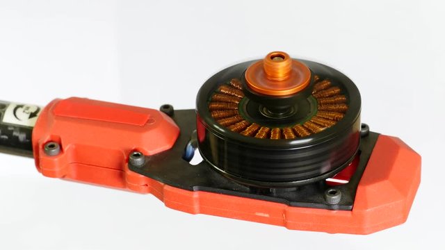 Multicopter frame arm with spinning brushless motor. Without a propeller, the load on motor is next to nothing. Amount of current being put back into the system is almost as high at the current taken