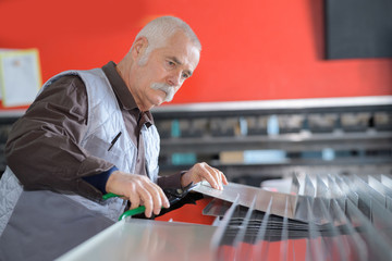 senior worker printing company employee