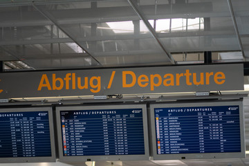Airport flight information on a large screen international departure board