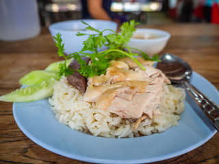 Hainanese chicken rice , Thai gourmet steamed chicken with rice, bean sauce and soup.