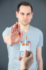 man showing hand stop smoking