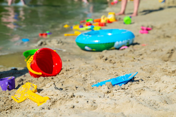 Fototapeta na wymiar inflatable ring kids toys at sand beach close up. nobody