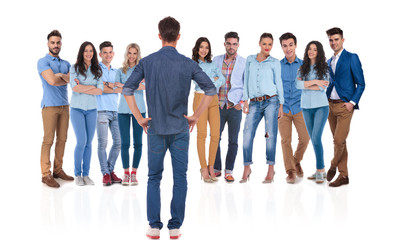 Fototapeta premium proud casual team leader looking at his team
