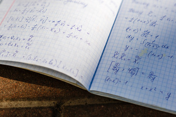 A school notebook with formulas