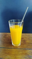 mango juice in the glass on the table