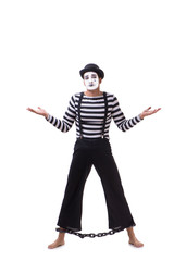 Mime with his feet chained isolated on white