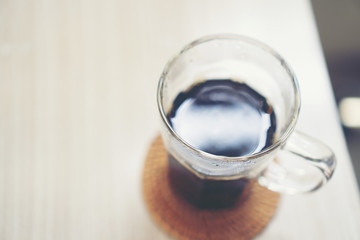 black hot coffee on table in the cafe