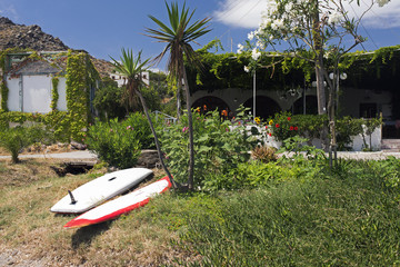 Surf boards in the beach in the island of Patmos, Greece in summer time