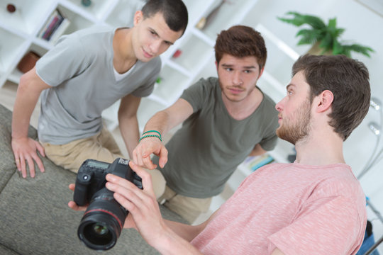 Young men looking at camera