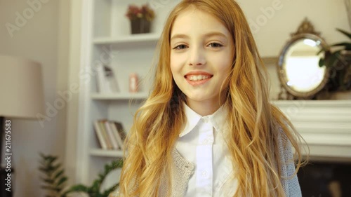 Portrait Of Pretty Little Girl With Long Blonde Hair Looking At