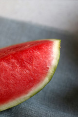 Fototapeta na wymiar Slice of watermelon on a table. Selective focus.