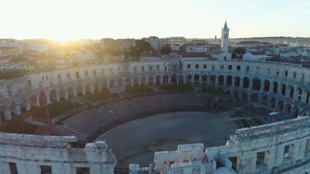 Fly away of historic Pula Arena in idyllic morning setting