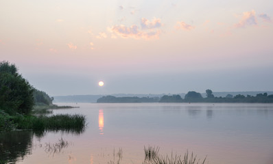 Fototapeta na wymiar Morning on a river with fog, fishing