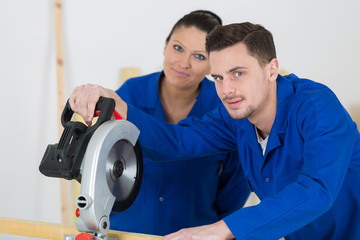 student in carpentry class using circular saw