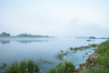 Morning on a river with fog, fishing